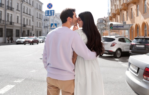 Couple sharing tender public intimacy moments