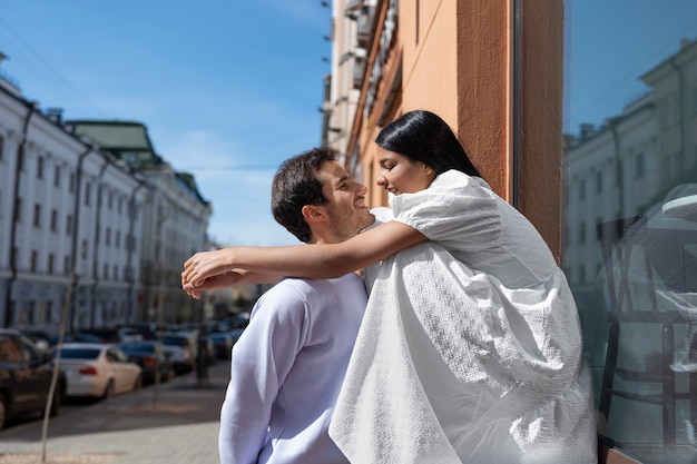 Couple sharing tender public intimacy moments