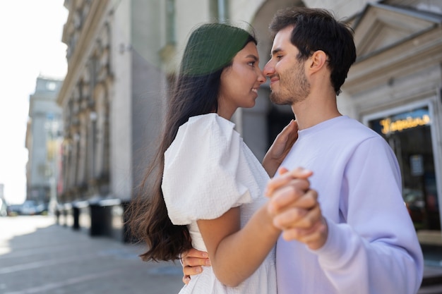 Couple sharing tender public intimacy moments