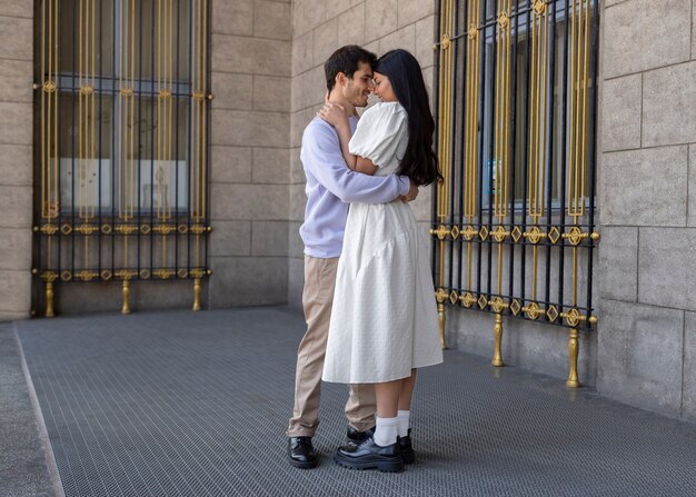 Couple sharing tender public intimacy moments