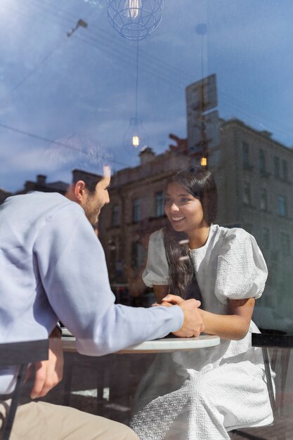 Couple sharing tender public intimacy moments