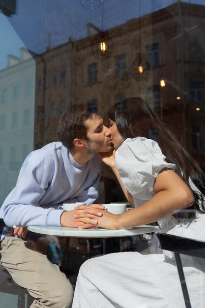 Couple sharing tender public intimacy moments