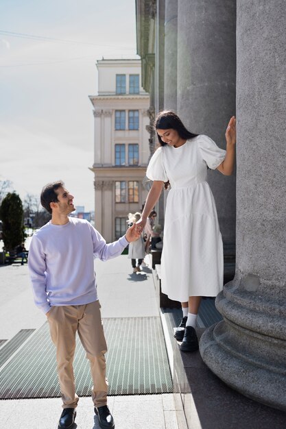 Couple sharing tender public intimacy moments