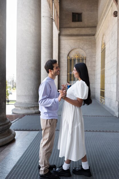 Couple sharing tender public intimacy moments