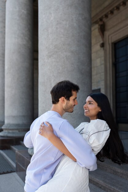 Couple sharing tender public intimacy moments