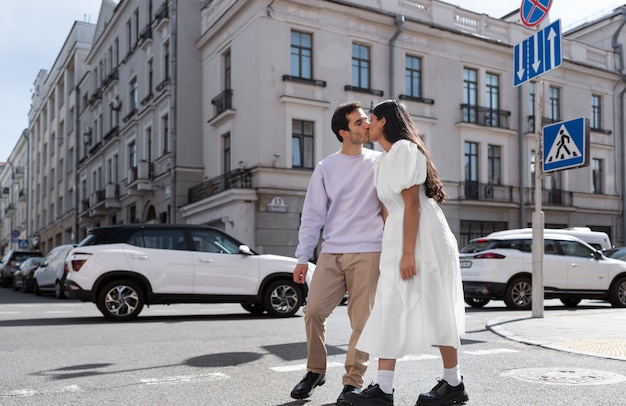 Couple sharing tender public intimacy moments