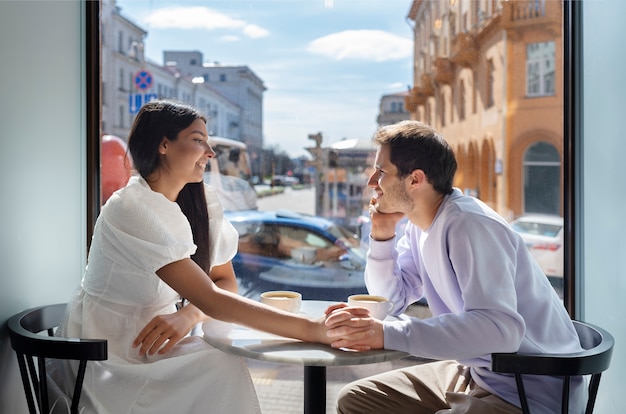 Couple sharing tender public intimacy moments