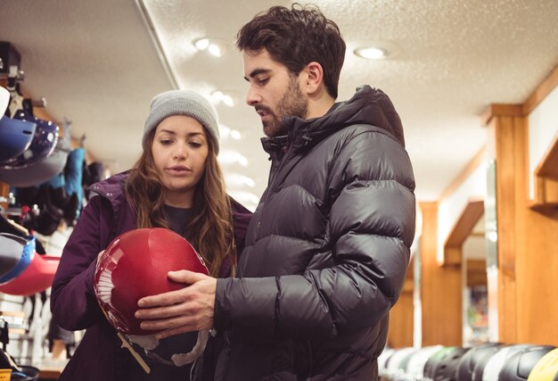 Couple shopping in a helmet shop