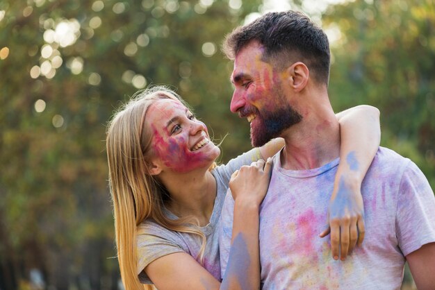 Couple showing affection at holi festival