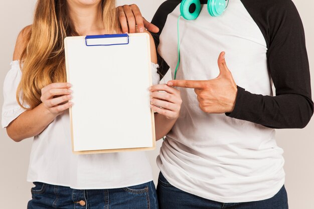 Couple showing clipboard