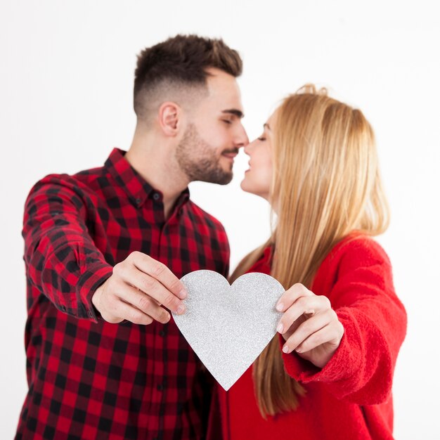 Couple showing paper heart