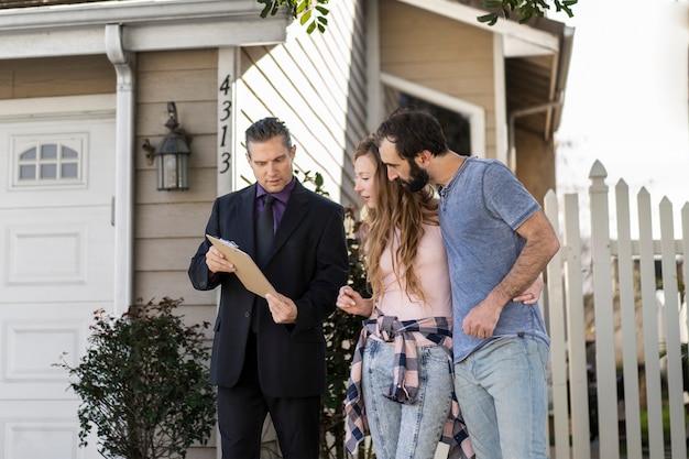 Couple signing papers fr new house