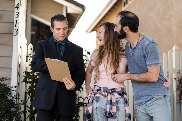 Free photo couple signing papers fr new house