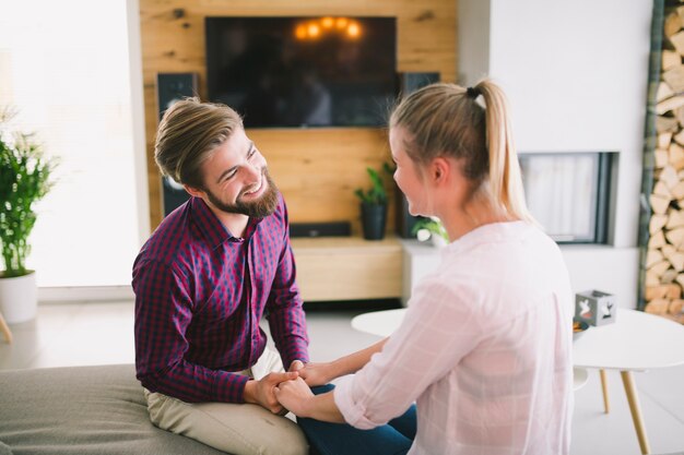 Couple sitting and holding hands