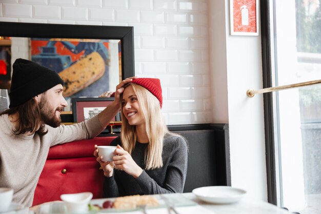 Couple sitting together in cafe