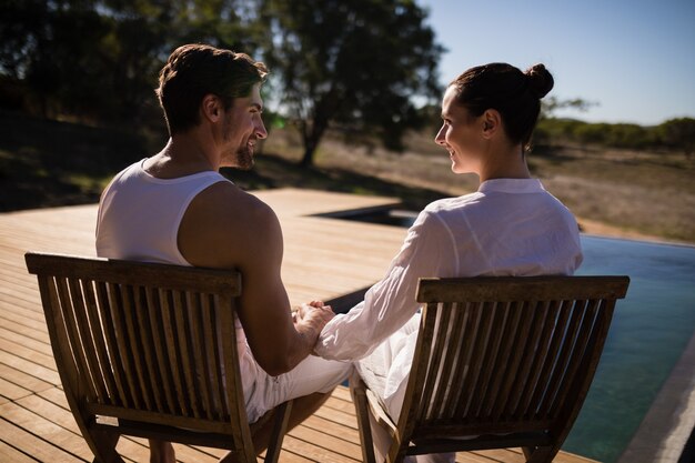 Couple sitting together on chair at safari vacation