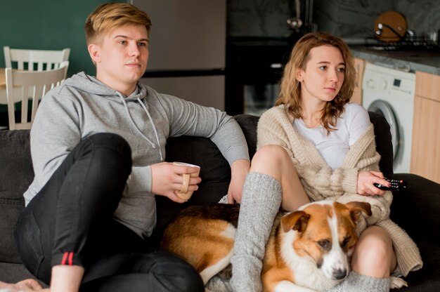 Couple sitting with dog