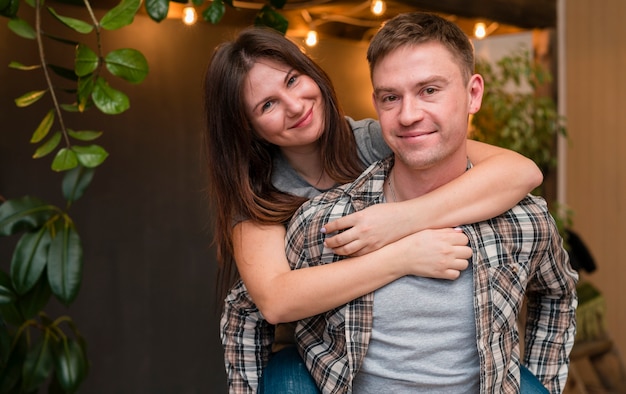 Couple smiling and posing embraced