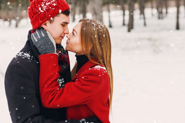 Couple smiling on a snowy day