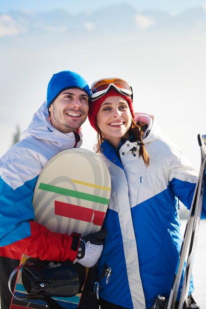 Couple of snowboarders in the mountains