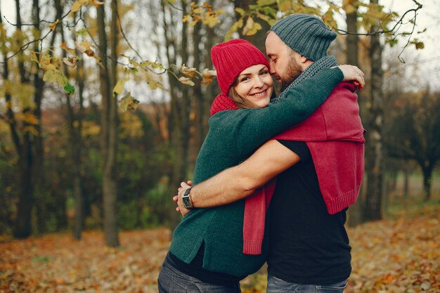 Couple spend time in a autumn park