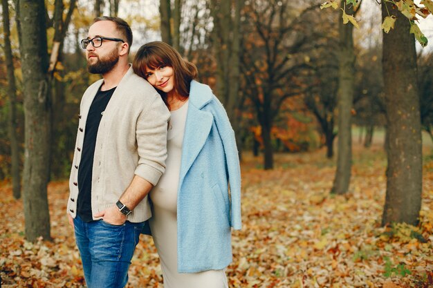 Couple spend time in a autumn park