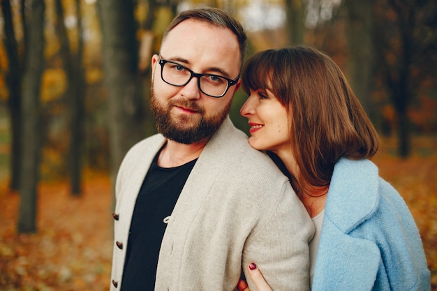 Couple spend time in a autumn park