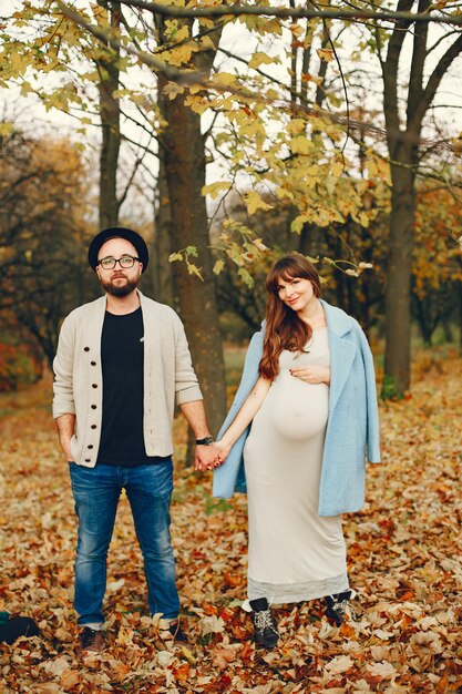 Couple spend time in a autumn park