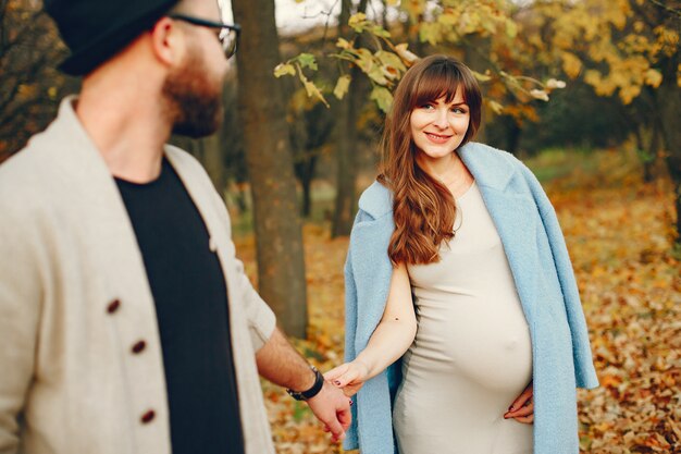 Couple spend time in a autumn park