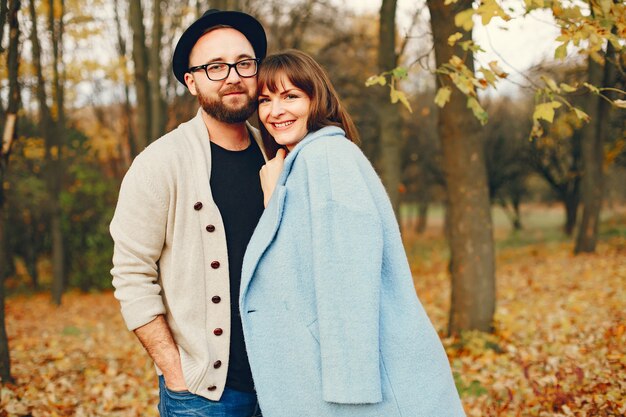 Couple spend time in a autumn park