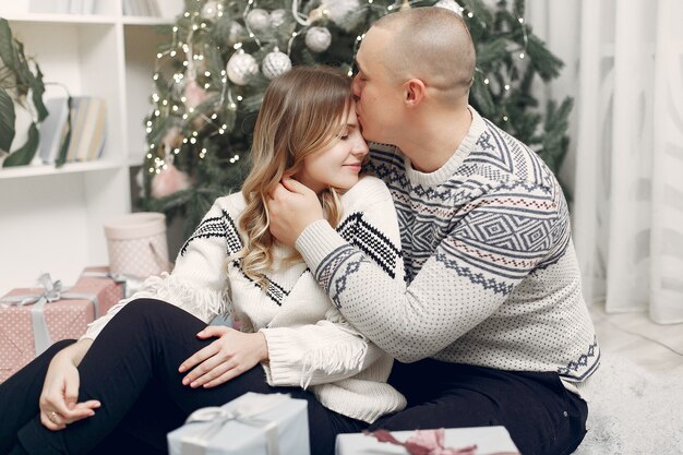 Couple spend time at home with christmas decorations