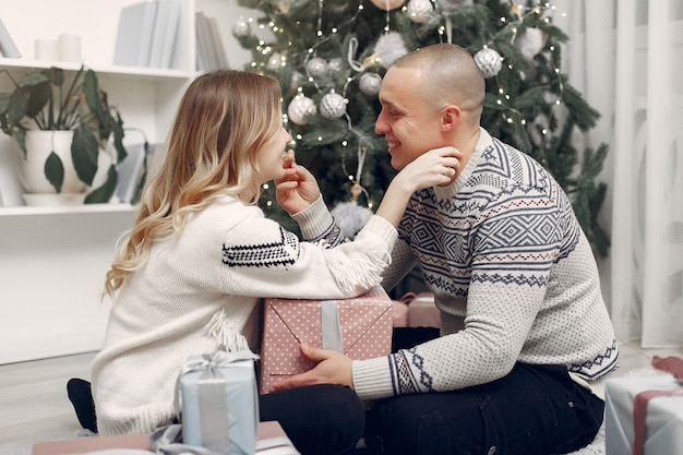 Couple spend time at home with christmas decorations