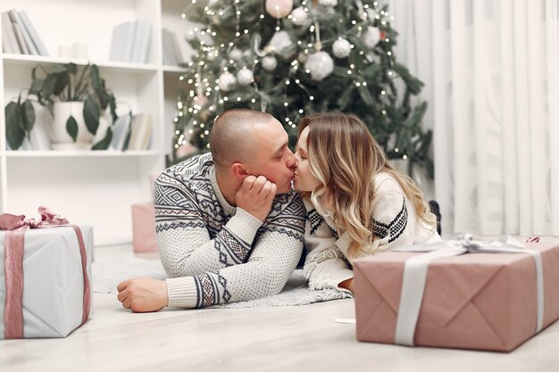 Couple spend time at home with christmas decorations