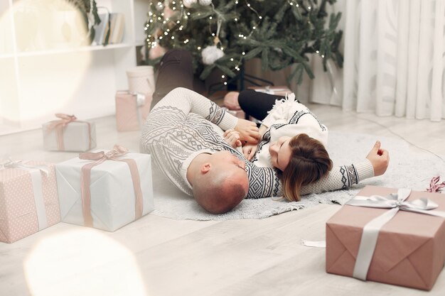 Couple spend time at home with christmas decorations