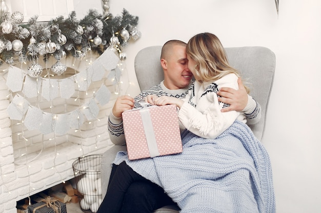 Couple spend time at home with christmas decorations