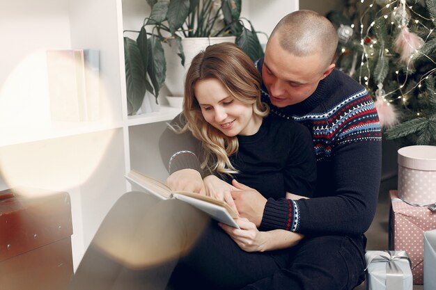 Couple spend time at home with christmas decorations