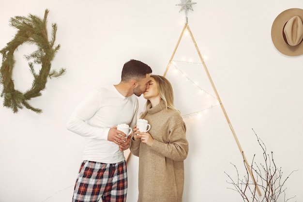 Couple spend time at home with christmas decorations