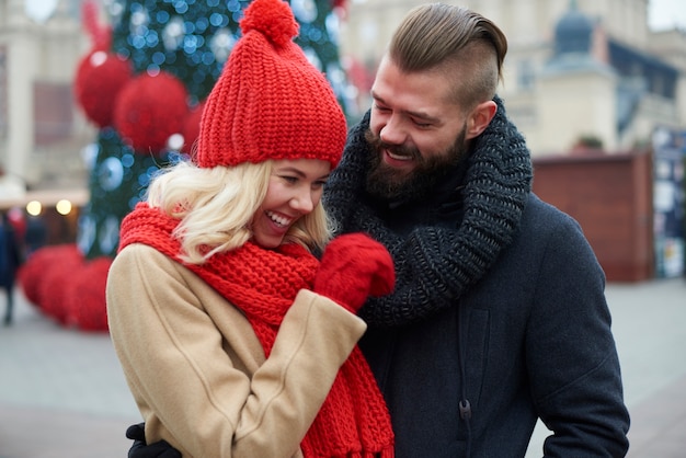 Couple spending funny time at the Christmas market