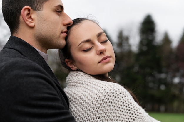 Couple spending time outdoors side view