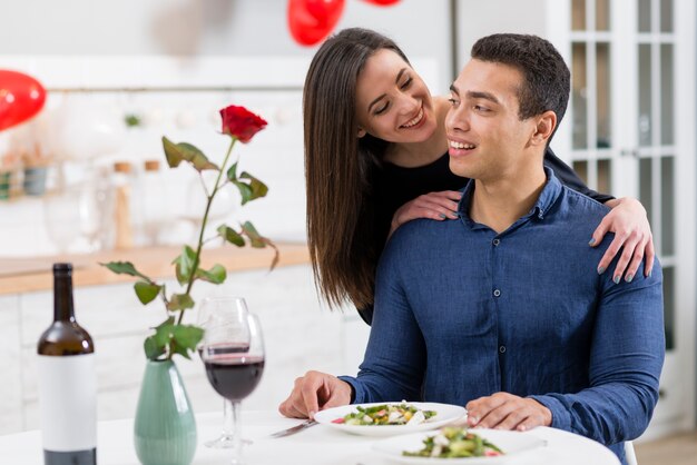 Couple spending time together on valentine's day at dinner table