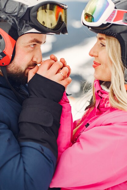 Couple in sport clothes. People spending winter vacation on mountains