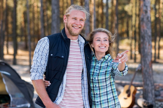 Couple standing in front of tent