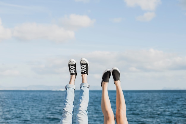 Free photo couple and summer concept with legs