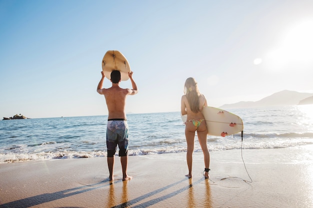 Couple of surfers waiting for waves