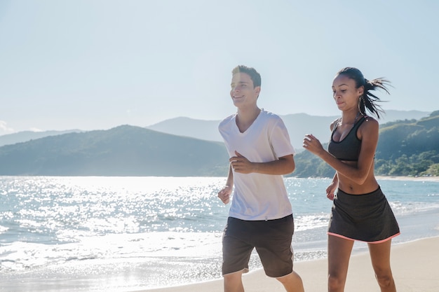 Free photo couple sweating on the beach