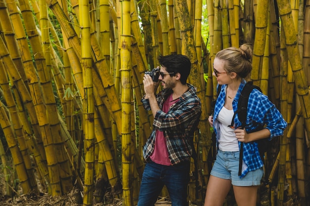 Couple taking photo in bamboo forest