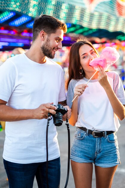 Couple taking photos at fair