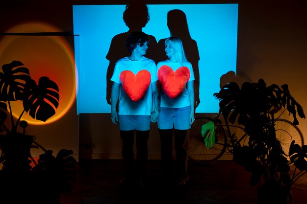 Couple taking photos in the light of movie projector