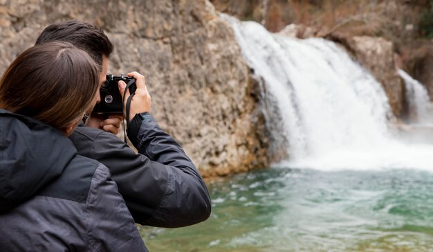 Couple taking photos of nature