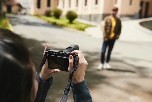 Free photo couple taking photos outdoors